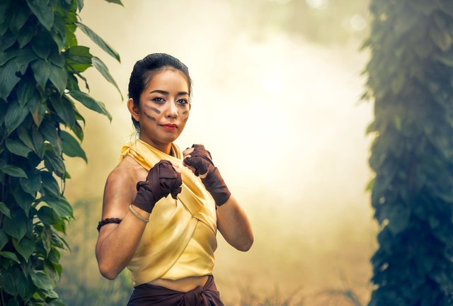 asian-lady-fighter-green-leaves.jpg
