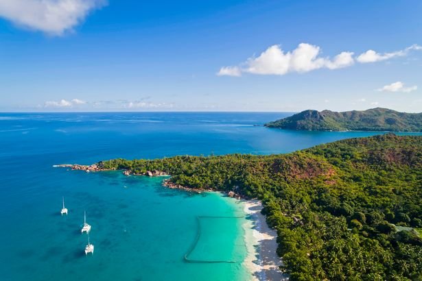 Seychelles-Praslin-Anse-Lazio-beach-and-fishing-net-Curieuse-Island-in-the-background-aerial-vi.jpg