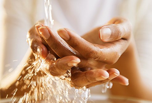 getty_rf_photo_of_african_american_woman_washing_hands.jpg