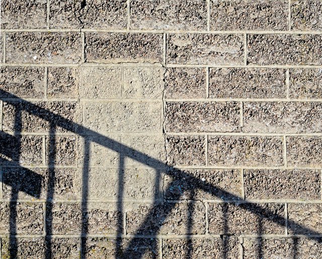 Shadow on a concrete brick wall