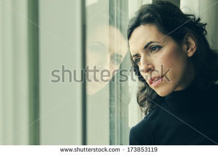 stock-photo-beautiful-year-old-woman-stands-in-front-of-the-window-173853119.jpg