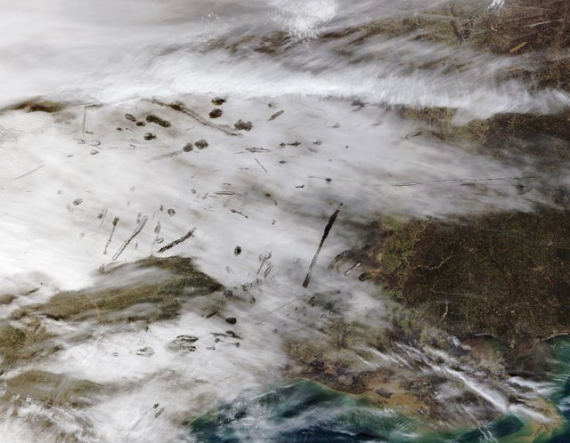 Satellite image of canals and fallstreak holes over east Texas.jpg