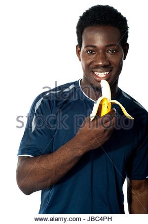 young-fit-guy-eating-banana-posing-in-front-of-camera-jbc4ph (1).jpg