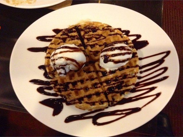 ice cream on waffles with chocolate poured on it.jpg