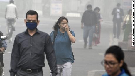 171110125205-delhi-pollution-face-covered-large-169.jpg