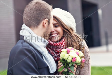 stock-photo-picture-showing-young-couple-with-flowers-kissing-in-the-city-515518531.jpg