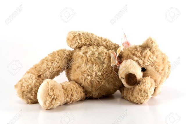 13873371-Cute-furry-brown-teddy-bear-laying-down-sick-holding-his-head-isolated-on-white-background-with-copy-Stock-Photo.jpg