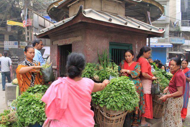 A roadside shrine makes a good place for business..jpg