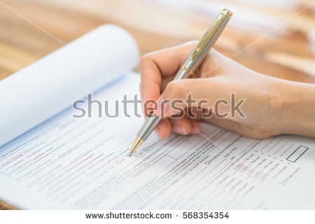 stock-photo-hand-with-pen-over-application-form-568354354.jpg