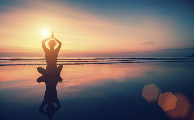 Silhouette-meditation-girl-on-background-of-the-sea-and-sunset-Final.jpg