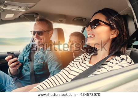 stock-photo-happy-family-riding-in-a-car-424578970.jpg