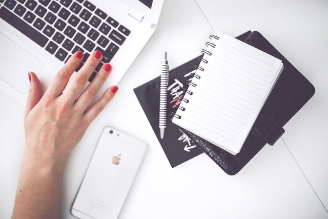 woman-hand-smartphone-desk.jpg