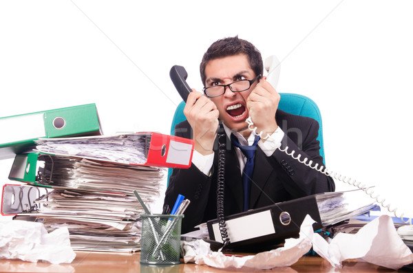 3853552_stock-photo-young-busy-businessman-at-his-desk.jpg