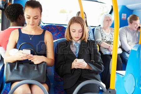 31019593-passengers-sitting-on-bus-sending-text-messages.jpg