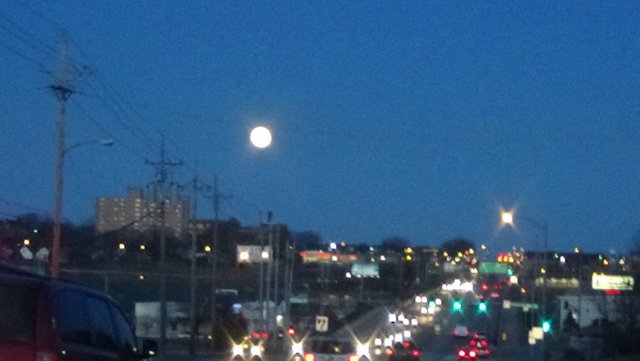 Omaha at sunset moon rising 3-1-18  traffic.jpg