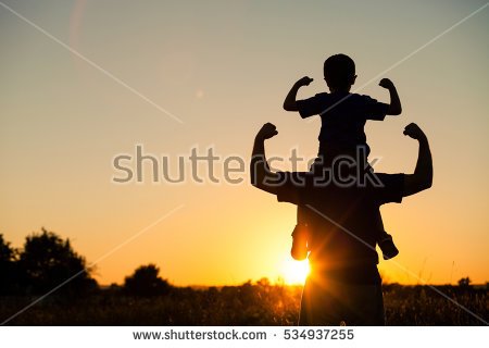 stock-photo-father-and-son-playing-in-the-park-at-the-sunset-time-people-having-fun-on-the-field-concept-of-534937255.jpg