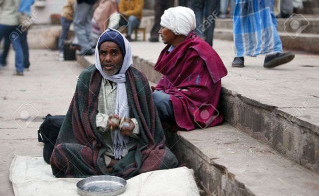 6888603-Varanasi-India-December-31-2009-Beggar-in-Varanasi-thousands-of-beggars-in-the-most-disadvantaged-ca-Stock-Photo.jpg