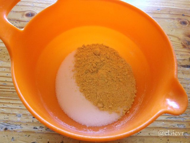 orange plastic bowl with mustard powder and sugar.jpg