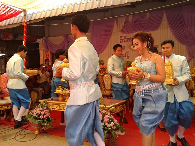 Part of the rituals where the newly wedded couple would do small circles before the 'hair-cutting' ceremony began.jpg