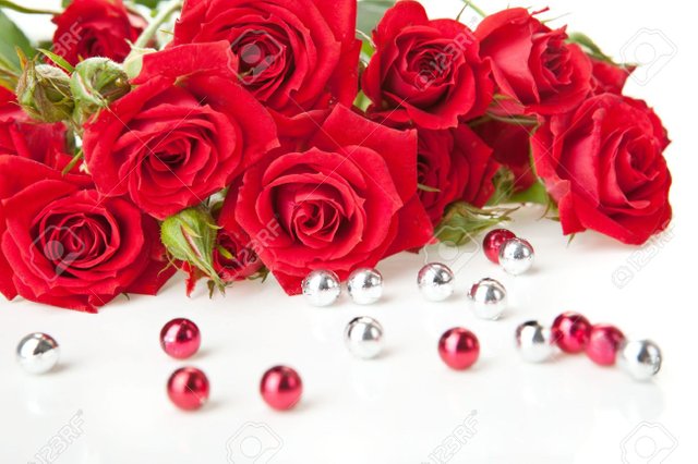 6102720-red-roses-bouquet-and-beads-on-white-background.jpg