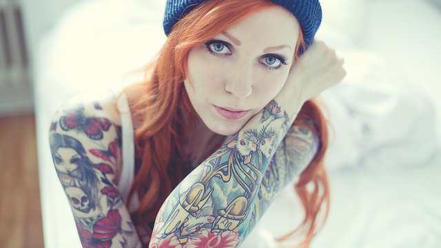 tattoowomenredheadfaceblueeyeswoollyhatevilladark-1520730790130-2048.jpg