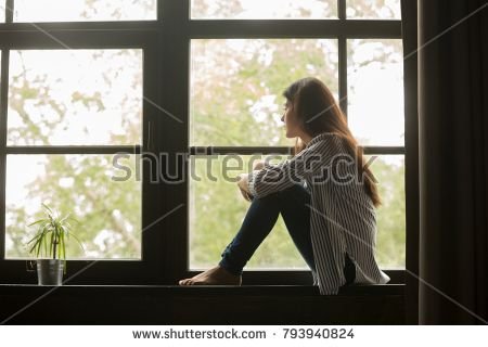 stock-photo-thoughtful-girl-sitting-on-sill-embracing-knees-looking-at-window-sad-depressed-teenager-spending-793940824-1.jpg