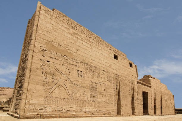 first-pylon-of-the-mortuary-temple-of-ramesses-iii-medinet-habu-egypt-picture-id668701866.jpg