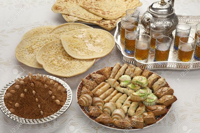 20996135-Traditional-Moroccan-tea-cookies-almond-sellou-and-pancakes-at-id-al-fitr-the-end-of-Ramadan-Stock-Photo.jpg