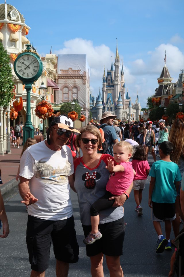 Nana and Papa baby castle view Magic Kingdom theme park at Walt Disney World Resort September 2017.JPG