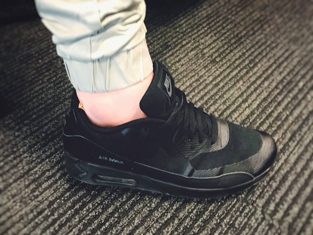 air max 90 triple black on feet