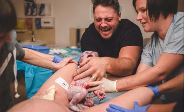 baby-born-his-dad-waiting-hands-1024x624.jpg