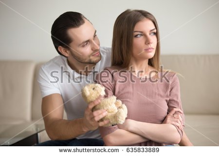 stock-photo-guilty-boyfriend-asking-for-forgiveness-presenting-offended-girlfriend-a-teddy-bear-toy-lady-635833889.jpg