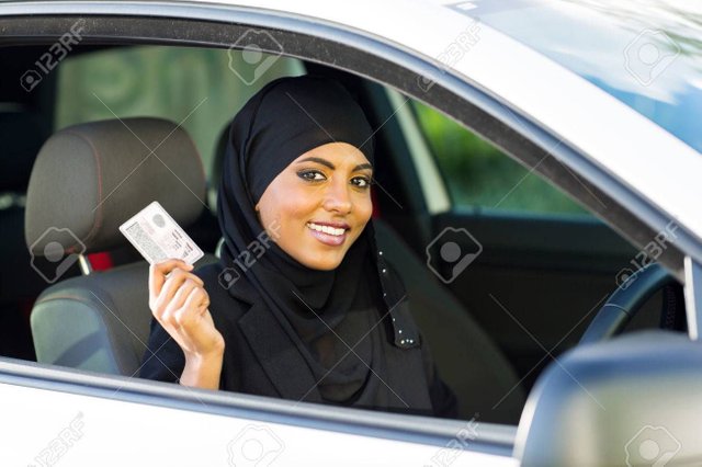 24947028-cheerful-muslim-woman-showing-a-driving-license-she-just-got-Stock-Photo.jpg