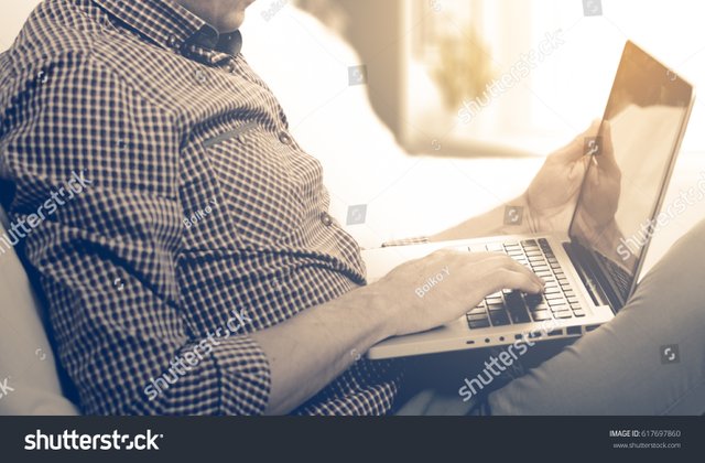 stock-photo-side-view-shot-of-a-man-s-hands-using-smart-phone-in-interior-rear-view-of-business-man-hands-busy-617697860.jpg