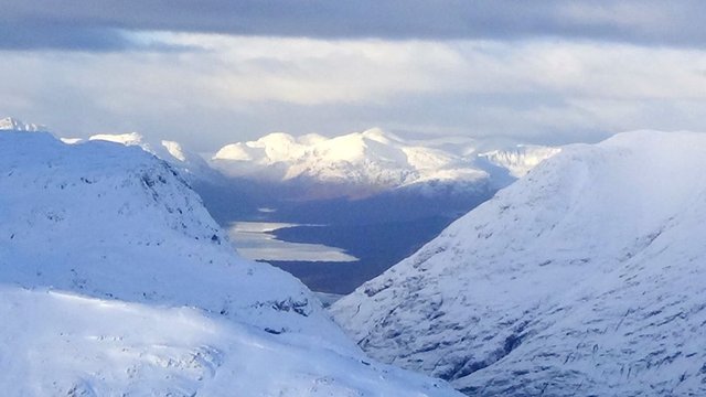 16 Loch Leven and Loch Linnhe zoomed and Ardgour hills Sgurr a'Chaorainn, Beinn na h-Uamha, Sgurr Dhomhnuill and others beyond, from summit of Stob Coire Raineach.jpg