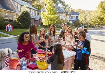 stock-photo-neighbours-helping-themselves-to-food-at-a-block-party-788925238.jpg