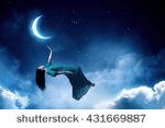 stock-photo-woman-in-night-sky-431669887.jpg