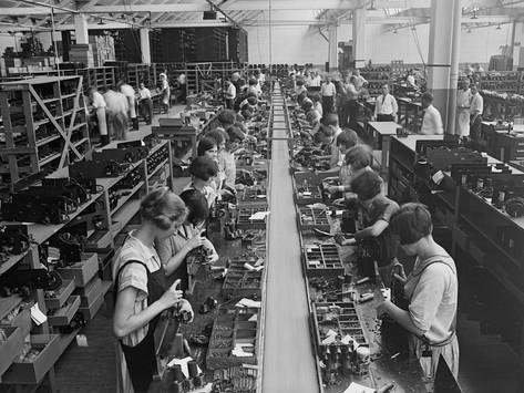 men-and-women-working-on-a-radio-assembly-line-in-washington-d-c-area-1925.jpg