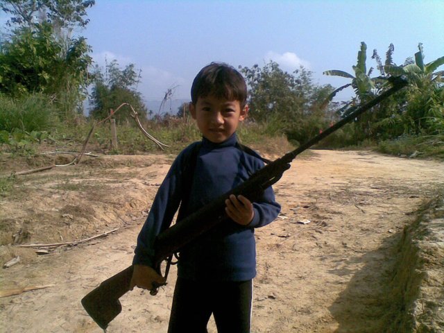 Bobby with Gun in Naga Hills.jpg