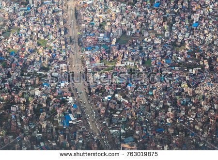 stock-photo-top-view-on-chaos-of-colored-buildings-the-heap-of-houses-in-the-asian-cities-caused-by-big-763019875.jpg