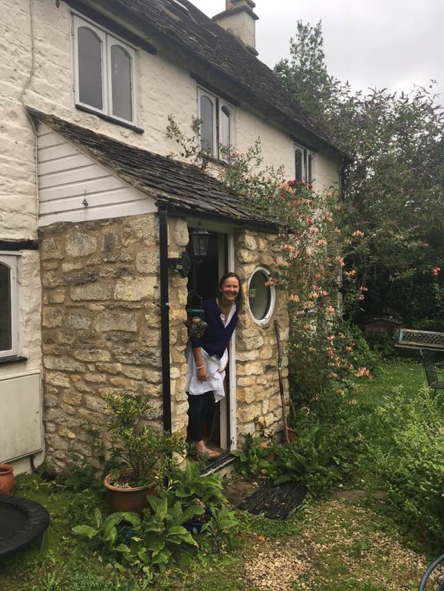 Heather at cottage door.jpg