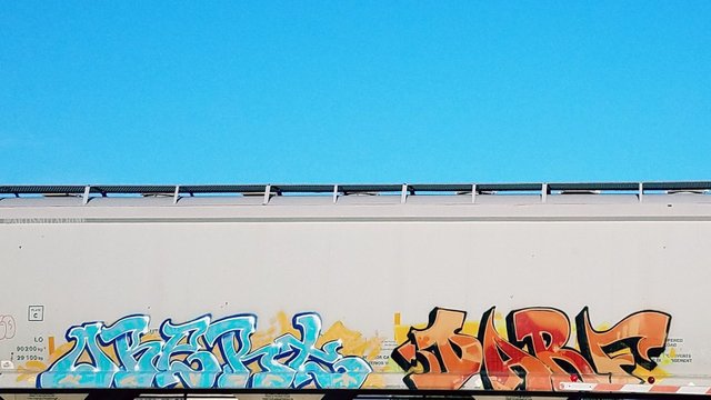 steemit-artisnotacrime-intro-april2018-train-blue-orange-grafitti-tag.jpg