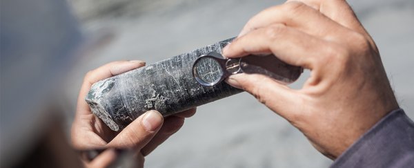 geologist_examining_ore_sample_getty_600.jpg