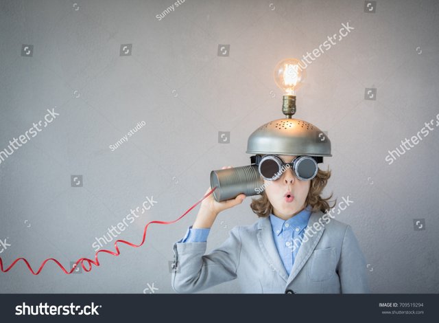 stock-photo-portrait-of-child-in-classroom-child-with-toy-virtual-reality-headset-in-class-funny-kid-with-709519294.jpg