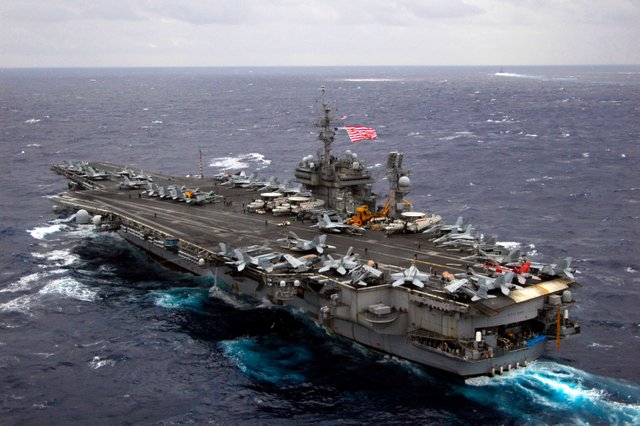 US_Navy_051115-N-8492C-378_Flying_the_First_Navy_Jack,_the_conventionally_powered_aircraft_carrier_USS_Kitty_Hawk_(CV_63)_prepares_to_conduct_flight_operations_following_a_formation_sail_with_ships_From_the_Japan_Maritime_Self.jpg