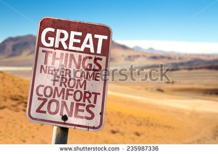 stock-photo-great-things-never-came-from-comfort-zones-sign-with-a-desert-background-235987336.jpg