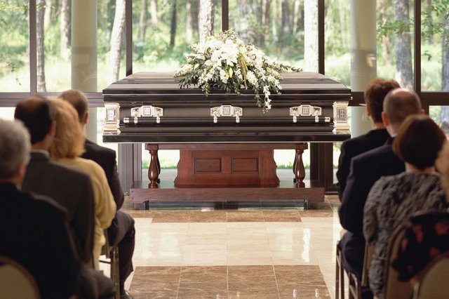 Funeral-casket-GettyImages-EC7431-001-5a3ee31322fa3a00364d1253.jpg