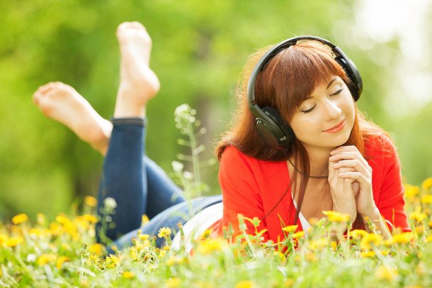 bigstock-Happy-woman-with-headphones-re-47401498-e1377603609636.jpg