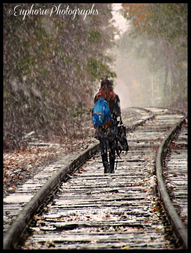 girl_walking_down_the_tracks_in_the_snow_by_euphoricphotographs-d5kkztk.jpg
