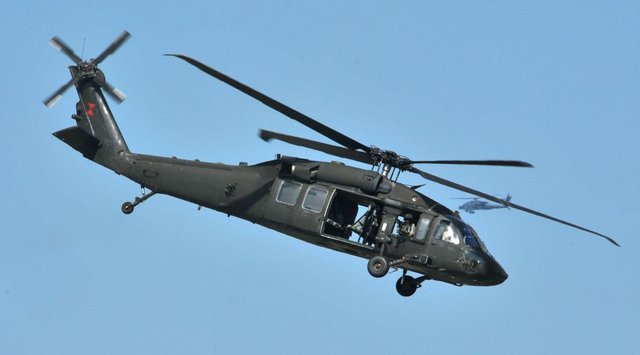 a_u-s-_army_uh-60_black_hawk_helicopter_assigned_to_the_159th_combat_aviation_brigade_101st_airborne_division_flies_off_after_unloading_soldiers_at_a_drop_point_during_air_assault_demo.jpg